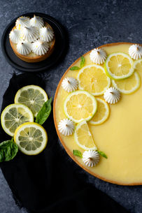 Lemon tart topped with meringue and lemon slices
